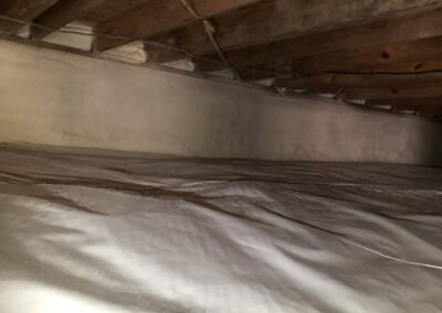 A residential crawl space encapsulated with spray foam insulation