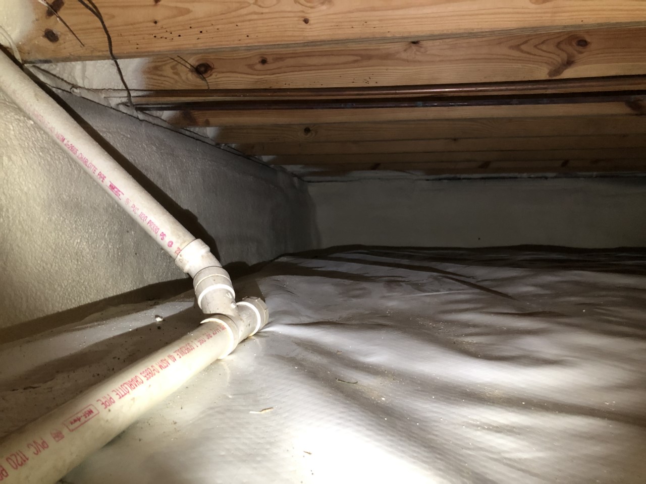 Crawl space insulation underneath of a residential home